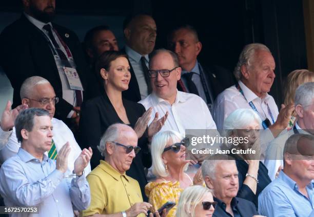 Princess Charlene of Monaco and Prince Albert II of Monaco, between Mark Alexander, president of the South African Rugby Union and Sir Bill Beaumont,...