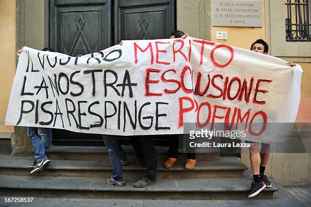 Students march with a banner against the Government during a demonstration outside the Scuola Superiore Sant'Anna on April 23, 2013 in Pisa, Italy....
