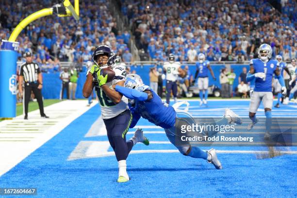 Wide receiver Tyler Lockett of the Seattle Seahawks catches a touchdown pass during the second half of an NFL football game against the Detroit Lions...