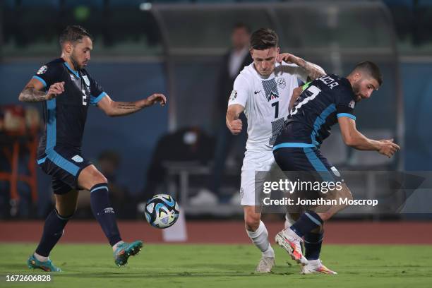 Benjamin Verbic of Slovenia clashes with Alessandro D'Addario and Alessandro Golinucci of San Marino during the UEFA EURO 2024 European qualifier...