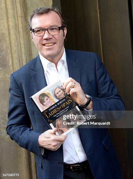 Writer Andrew Morton poses with his latest book 'Ladies of Spain' during Sant Jordi day celebrations on April 23, 2013 in Barcelona, Spain. Sant...