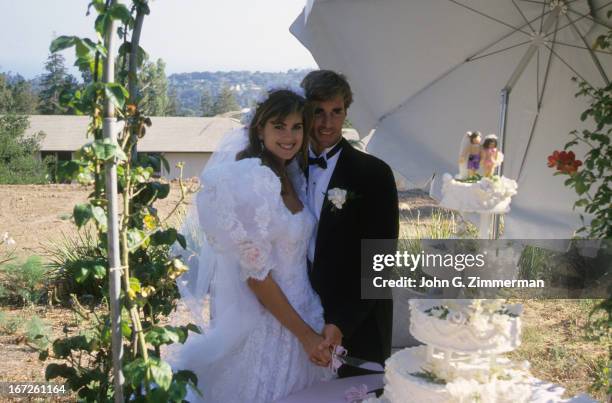 Portrait of Sports Illustrated via Getty Images swimsuit model Kathy Ireland with husband Dr. Greg Olsen on wedding day. San Diego, CA 8/21/1988...