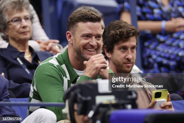 American singer-songwriter Justin Timberlake looks on during the Men's Singles Final match between Novak Djokovic of Serbia and Daniil Medvedev of...