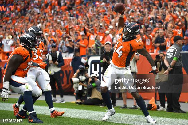 Courtland Sutton of the Denver Broncos celebrates after scoring a touchdown during the second quarter against the Las Vegas Raiders at Empower Field...
