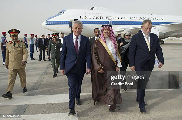 Defense Secretary Chuck Hagel walks with Deputy Minister of Defense Prince Fahd bin Abdullah upon his arrival at King Khaled International Airport on...