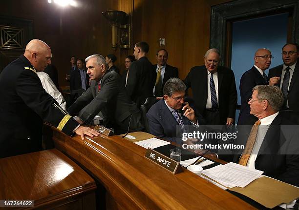 Chief of Staff of the U.S. Army Gen. Raymond Odierno , talks with Sen. Jack Reed while Senators Joe Manchin , Chairman Carl Levin and James Inhofe...