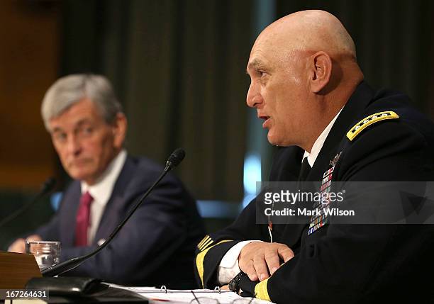 Chief of Staff of the U.S. Army Gen. Raymond Odierno , and Secretary of the Army John McHugh speak before the Senate Armed Services Committee, on...