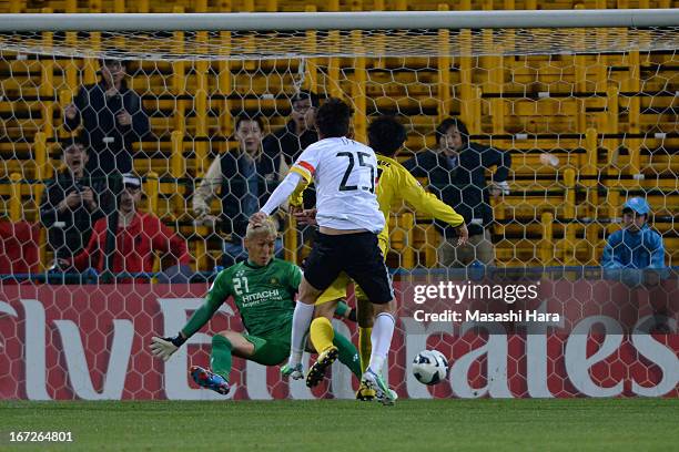 Li Kai of Guizhou Renhe scores the first goal during the AFC Champions League Group H match between Kashiwa Reysol and Guizhou Renhe at Hitachi...