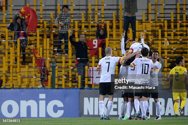 Guizhou Renhe players and supporters celebrate the first goal during the AFC Champions League Group H match between Kashiwa Reysol and Guizhou Renhe...