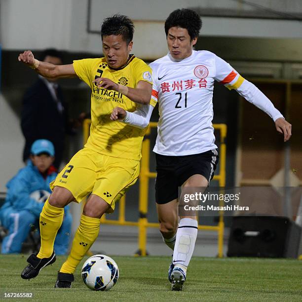 Masato Fujita of Kashiwa Reysol and Yu Hai of Guizhou Renhe compete for the ball during the AFC Champions League Group H match between Kashiwa Reysol...