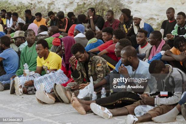 Migrants wait to be transferred in the Cala Pisana of Lampedusa Island, Italy on September 17, 2023. Massive transfer of migrants is taking place...