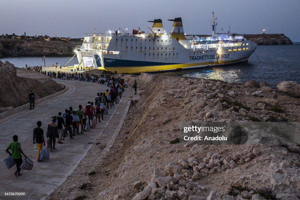 Migrants transferred from the island of Lampedusa to mainland Italy