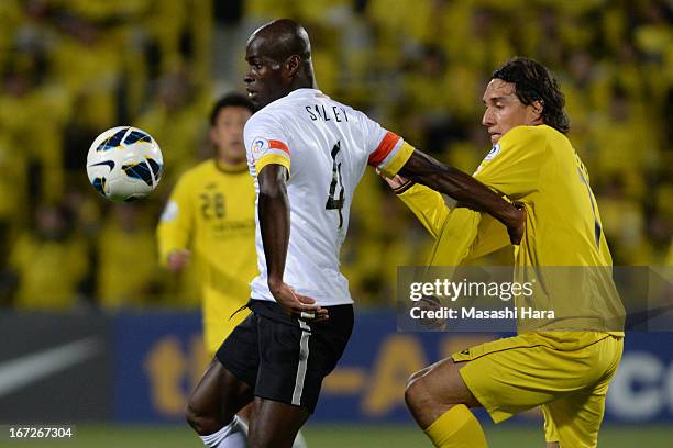 Jonas Salley of Guizhou Renhe and Cleo of Kashiwa Reysol compete for the ball during the AFC Champions League Group H match between Kashiwa Reysol...