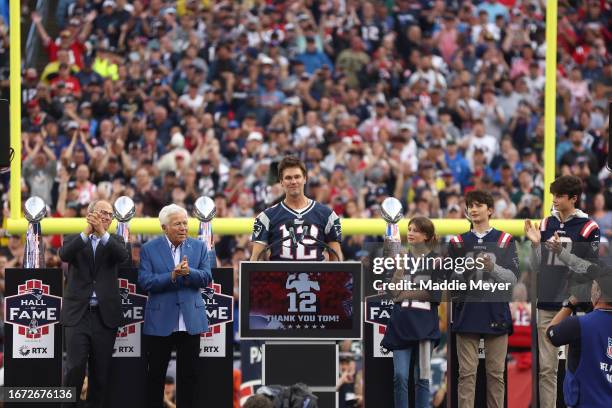 New England Patirots President Jonathan Kraft, New England Patriots owner Robert Kraft clap as former New England Patriots quarterback Tom Brady...