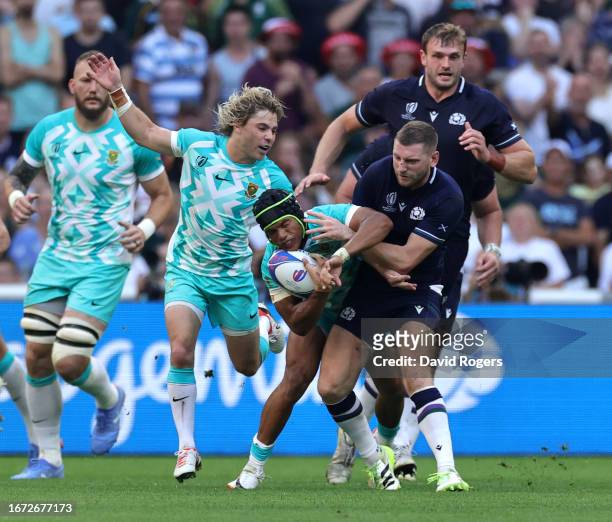 Finn Russell of Scotland injures his ribs after colliding with Kurt-Lee Arendse during the Rugby World Cup France 2023 Group B match between South...