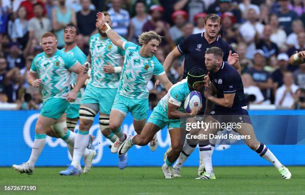 Finn Russell of Scotland injures his ribs after colliding with Kurt-Lee Arendse during the Rugby World Cup France 2023 Group B match between South...