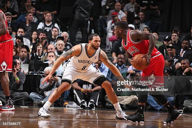 Deron Williams of the Brooklyn Nets defends against Nate Robinson of the Chicago Bulls in Game Two of the Eastern Conference Quarterfinals during the...