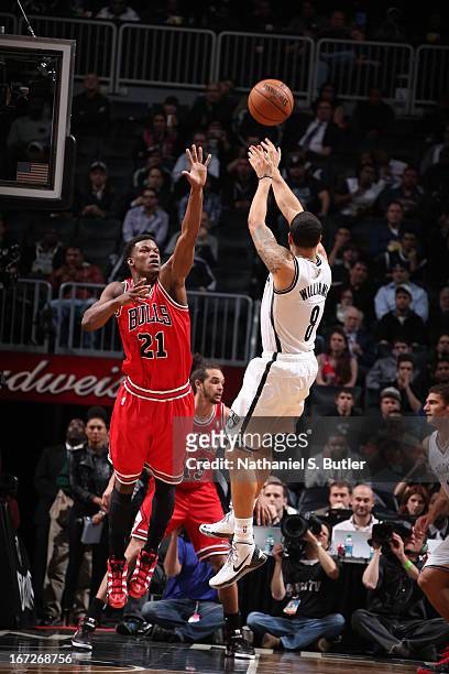 Jimmy Butler of the Chicago Bulls defends against Deron Williams of the Brooklyn Nets in Game Two of the Eastern Conference Quarterfinals during the...