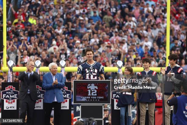 New England Patriots President Jonathan Kraft, New England Patriots owner Robert Kraft clap as former New England Patriots quarterback Tom Brady...