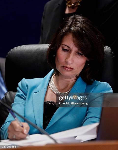 Deborah Hersman, chairman of the National Transportation Safety Board , makes notes during a hearing at the NTSB in Washington, D.C., U.S., on...