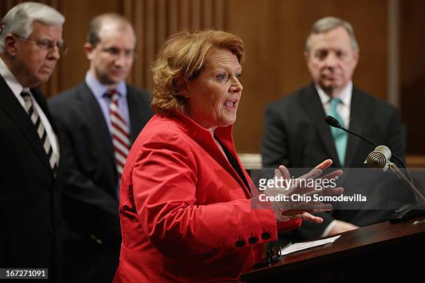 Sen. Heidi Heitkamp participates in a news conference about the Marketplace Fairness Act with Sen. Mike Enzi , Peter Sides of the Robert M. Sides...