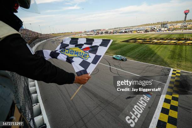 Tyler Reddick MoneyLion Toyota, driver of the 23XI Racing, takes the checkered flag to win the NASCAR Cup Series Hollywood Casino 400 at Kansas...