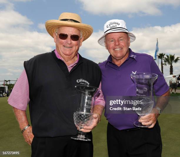 Bob Murphy and Jim Colbert pose with their trophies after defeating Larry Ziegler and Frank Beard in a one-hole playoff during the final round of the...