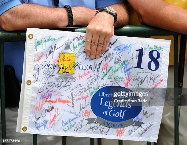 Fan waits to have his pin flag autographed on the 18th hole during the final round of the Demaret Division at the Liberty Mutual Insurance Legends of...