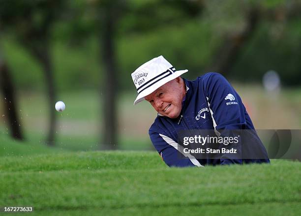 Jim Colbert hits from a bunker on the first hole during the final round of the Demaret Division at the Liberty Mutual Insurance Legends of Golf at...