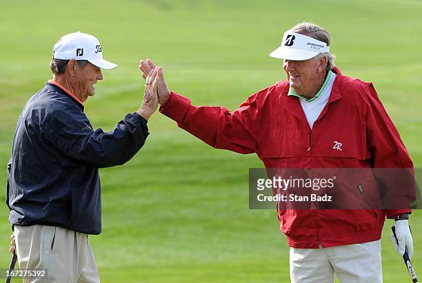 Jimmy Powell and Al Geiberger celebrate on the first hole during the final round of the Demaret Division at the Liberty Mutual Insurance Legends of...