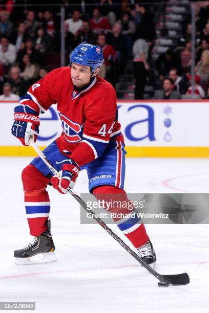 Davis Drewiske of the Montreal Canadiens skates with the puck during the NHL game against the Winnipeg Jets at the Bell Centre on April 4, 2013 in...