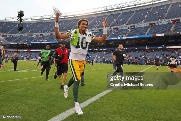 Jordan Love of the Green Bay Packers celebrates the 38-20 win against the Chicago Bears as he runs of the field at Soldier Field on September 10,...