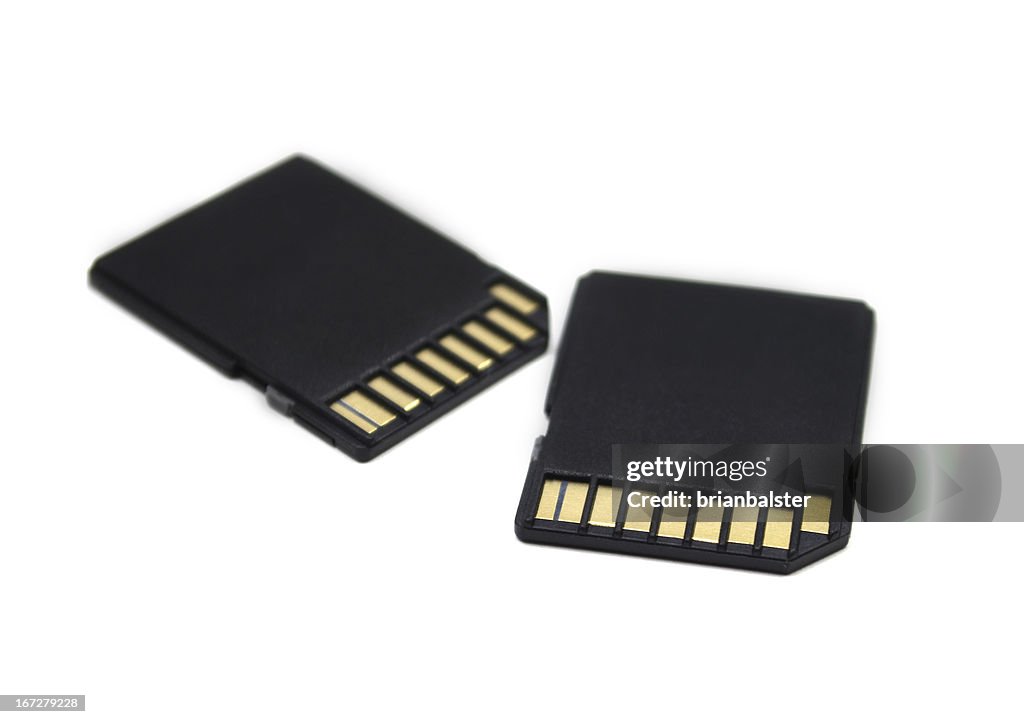 Close-up of two black memory cards on a white background
