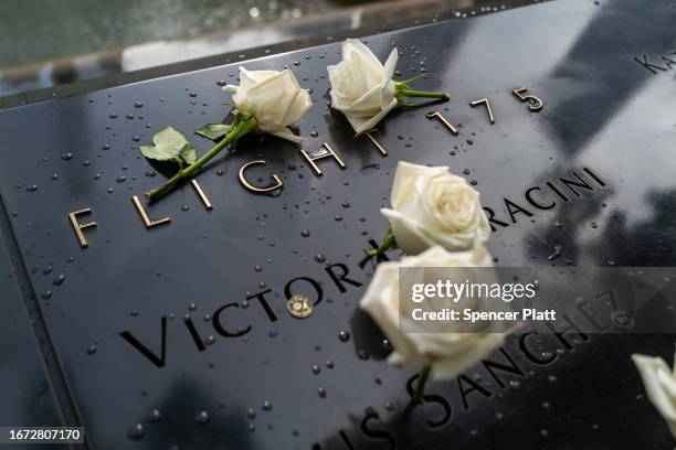 Flowers are placed by names on Flight 175 at the 9/11 Memorial at the Ground Zero site in lower Manhattan as the nation prepares to commemorate the...