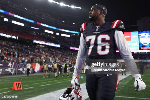 Calvin Anderson of the New England Patriots walks off the field after his team's 25-20 loss against the Philadelphia Eagles at Gillette Stadium on...