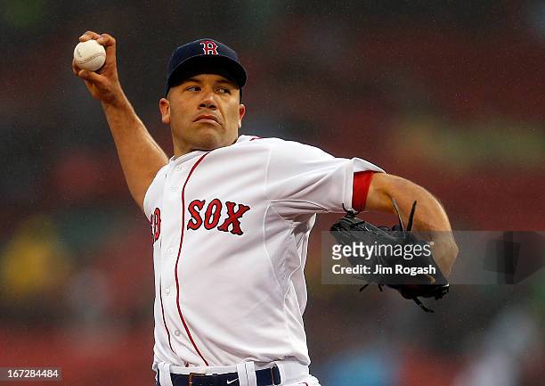 Alfredo Aceves of the Boston Red Sox throws during a game with Oakland Athletics at Fenway Park on April 23, 2013 in Boston, Massachusetts.