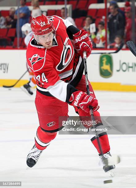 Bobby Sanguinetti of the Carolina Hurricanes takes a shot during warmups prior to an NHL game against the New York Islanders at PNC Arena on April...