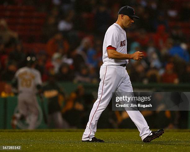 Alfredo Aceves of the Boston Red Sox paces in the 3rd inning during which he gave up six runs to the Oakland Athletics at Fenway Park on April 23,...