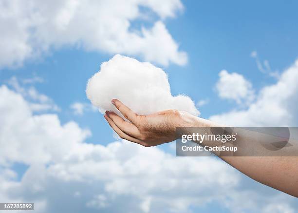 when the clouds can hold in your hands. - catching hands stock pictures, royalty-free photos & images