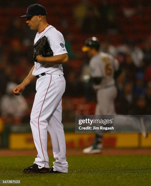 Seth Smith of the Oakland Athletics rounds the bases after hitting a home run against Alfredo Aceves of the Boston Red Sox pauses in the 4th inning...