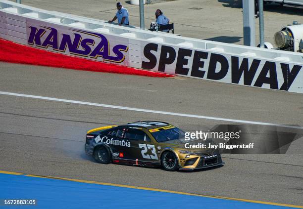 Bubba Wallace, driver of the Columbia Sportswear Company Toyota, drives after blowing his rear tire during the NASCAR Cup Series Hollywood Casino 400...