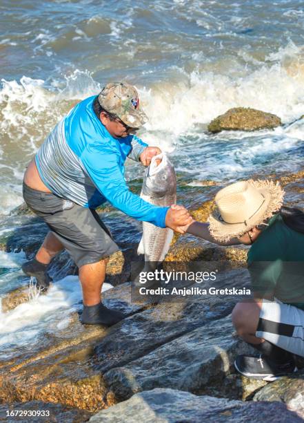 Man Getting Fish 69 Man Caught Big Fish Stock Photos, High-Res Pictures, and Images ...