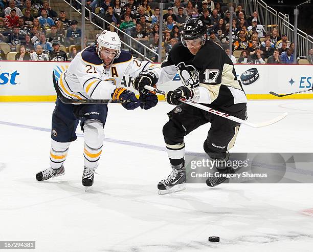 Dustin Jeffrey of the Pittsburgh Penguins battles for the loose puck against Drew Stafford of the Buffalo Sabres on April 23, 2013 at Consol Energy...