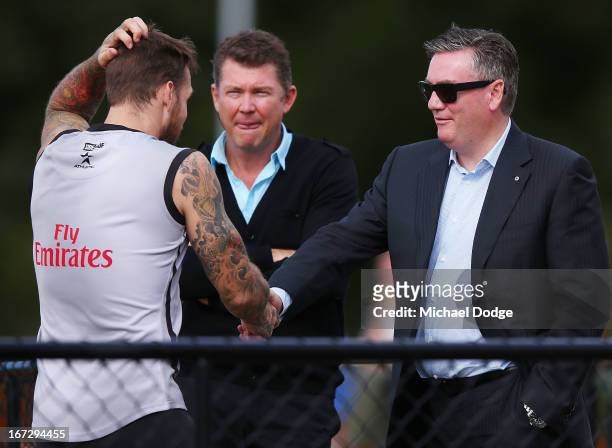 Dane Swan and President Eddie McGuire shake hands during a Collingwood Magpies AFL training session at Olympic Park on April 24, 2013 in Melbourne,...