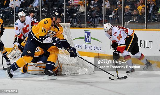 Hal Gill of the Nashville Predators skates against Ben Hanowski of the Calgary Flames at the Bridgestone Arena on April 23, 2013 in Nashville,...