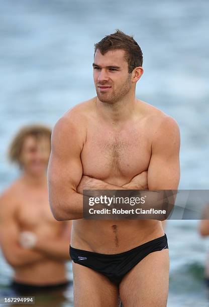 Stewart Crameri of the Bombers walks in the water during a Essendon Bombers recovery session at the St Kilda Sea Baths on April 24, 2013 in...