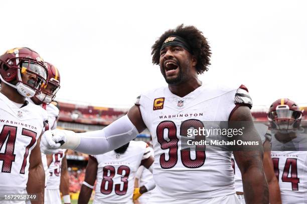 Jonathan Allen of the Washington Commanders reacts as he leads a huddle prior to a game between the Washington Commanders and the Arizona Cardinals...