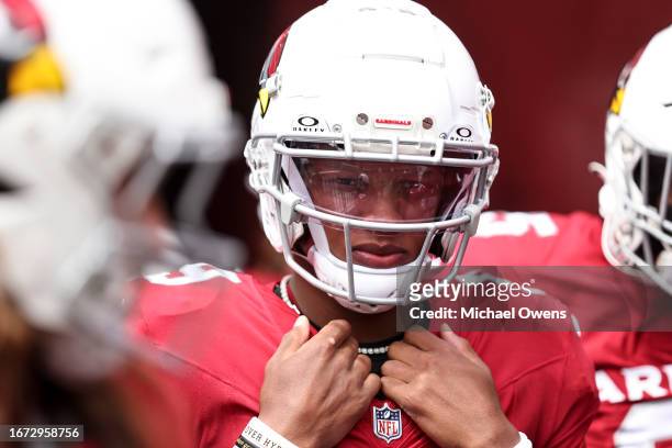 Joshua Dobbs of the Arizona Cardinals looks on before taking the field prior to a game between the Washington Commanders and the Arizona Cardinals at...