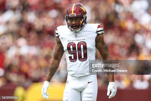 Montez Sweat of the Washington Commanders looks on during a game between the Washington Commanders and the Arizona Cardinals at FedExField on...