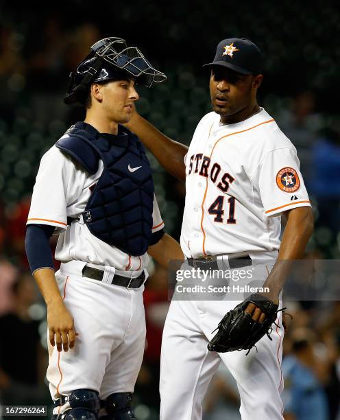 Jason Castro and Jose Veras of the Houston Astros celebrate after defeating the Seattle Mariners 3-2 at Minute Maid Park on April 23, 2013 in...